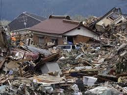 Find earthquake survivors in a "race against time" as Japan lifts tsunami warnings and the death toll increases